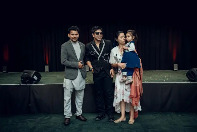 A family and their little one with Prakash Saput